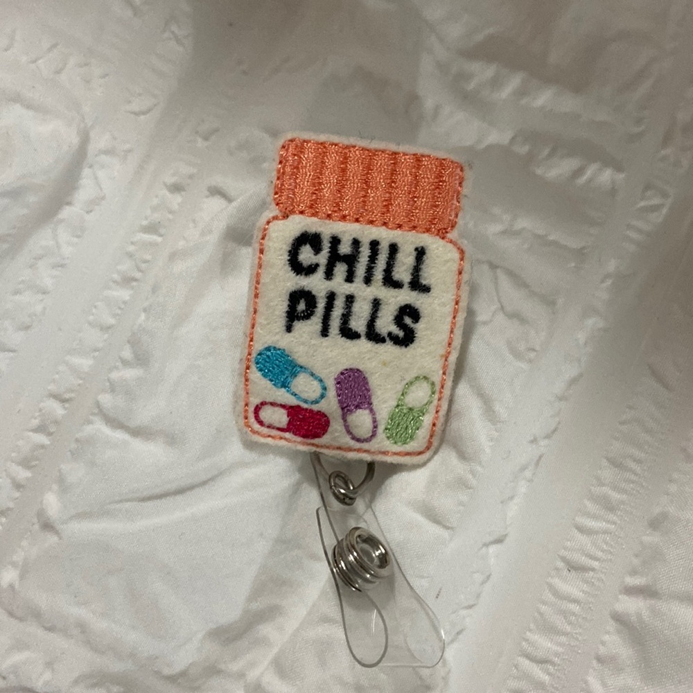 BRAND NEW chill pills badge reel